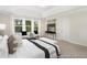 Luxurious main bedroom boasts a tray ceiling, oversized windows, and sophisticated decor at 714 N Hickory St # 13, Summerville, SC 29483