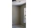 Bedroom with light gray walls, white tile floor, and a window with a view at 7774 Ginger Ln, North Charleston, SC 29420
