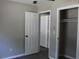 Bedroom featuring light gray walls, ceiling fan, and a closet at 7774 Ginger Ln, North Charleston, SC 29420