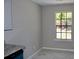 Bright dining area with marble floors, a large window and view of neighborhood at 7774 Ginger Ln, North Charleston, SC 29420