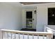 Charming front porch with a secure screen door, providing both security and curb appeal at 7774 Ginger Ln, North Charleston, SC 29420