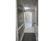 Bright hallway with marble floors and white trim leading to other rooms in the home at 7774 Ginger Ln, North Charleston, SC 29420