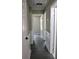 Hallway featuring light gray walls, white trim, and doors leading to other rooms at 7774 Ginger Ln, North Charleston, SC 29420