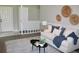 Bright and comfy living room featuring a stylish rug, modern sofa, and decor at 7774 Ginger Ln, North Charleston, SC 29420