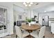 Inviting dining area adjacent to the kitchen features a round table, neutral chairs, and easy access to living spaces at 7869 High Maple Cir, North Charleston, SC 29418