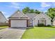 Charming single-story home with a brick-accented garage and well-maintained lawn at 7869 High Maple Cir, North Charleston, SC 29418