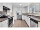 Well-lit kitchen featuring stainless steel appliances, ample cabinet space, and an efficient layout at 7869 High Maple Cir, North Charleston, SC 29418