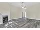 Inviting living room with fireplace and wood-look flooring at 7869 High Maple Cir, North Charleston, SC 29418