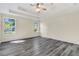 Spacious main bedroom with large windows, tray ceilings, and a modern design creating a peaceful retreat at 7869 High Maple Cir, North Charleston, SC 29418