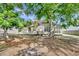 View of the rear of the home, highlighting a bright sunroom with ample windows at 7869 High Maple Cir, North Charleston, SC 29418