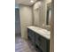 Bathroom featuring double sink vanity with shaker cabinets, framed mirrors, and tiled backsplash at 852 Lawyer Ln, Cross, SC 29436