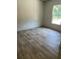Bedroom featuring stylish wood flooring, neutral paint, and natural lighting at 846 Lawyer Ln, Cross, SC 29436