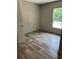 A bedroom featuring hard surface floors, a window letting in natural light, and neutral paint at 846 Lawyer Ln, Cross, SC 29436