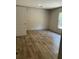 Bedroom featuring stylish wood flooring, neutral paint, and natural lighting at 846 Lawyer Ln, Cross, SC 29436