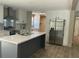Kitchen with stainless steel appliances, ample cabinet space, large kitchen island, and eat in bar at 846 Lawyer Ln, Cross, SC 29436