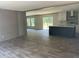Living Room with kitchen, grey walls, an island and a glass door to let natural light in at 846 Lawyer Ln, Cross, SC 29436