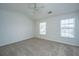 Bedroom with neutral carpet, ceiling fan and two windows at 9098 Maple Grove Dr, Summerville, SC 29485