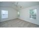 Bedroom featuring neutral carpet, ceiling fan and two windows at 9098 Maple Grove Dr, Summerville, SC 29485