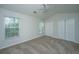Bedroom featuring neutral carpet, ceiling fan, two windows, and closet at 9098 Maple Grove Dr, Summerville, SC 29485