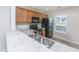 Practical kitchen with stainless steel sink, black appliances, and light countertops at 9098 Maple Grove Dr, Summerville, SC 29485