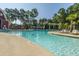 Inviting outdoor pool surrounded by lounge chairs and mature trees for shade at 9098 Maple Grove Dr, Summerville, SC 29485