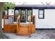 A well-crafted back deck featuring wood stairs, black metal railings, and a black framed door at 10 Bayshore Blvd, Goose Creek, SC 29445