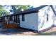 Backyard of a white brick house featuring a wooden deck at 10 Bayshore Blvd, Goose Creek, SC 29445