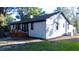 A white brick house featuring a wooden deck in the backyard at 10 Bayshore Blvd, Goose Creek, SC 29445