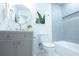 Beautiful bathroom with a tiled shower, toilet, and vanity with gold fixtures and decor at 10 Bayshore Blvd, Goose Creek, SC 29445