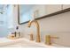 Bathroom featuring modern fixtures including a golden faucet and soap dispenser at 10 Bayshore Blvd, Goose Creek, SC 29445