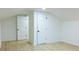 Bright bedroom featuring light wood flooring and two doors at 10 Bayshore Blvd, Goose Creek, SC 29445