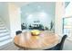 Bright dining room featuring a round table with wood grain finish near to living room at 10 Bayshore Blvd, Goose Creek, SC 29445