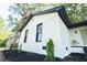 Exterior of a bright white home with black trim, black mulch, and newly planted landscaping at 10 Bayshore Blvd, Goose Creek, SC 29445