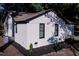 Exterior view of a renovated white brick home with black trim, well manicured landscaping, and a garage at 10 Bayshore Blvd, Goose Creek, SC 29445