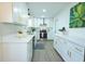 Bright kitchen featuring stainless appliances, white cabinets with gold pulls, and quartz countertops at 10 Bayshore Blvd, Goose Creek, SC 29445