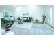 Inviting and spacious living area features a comfortable green sofa, stylish decor, and lots of natural light at 10 Bayshore Blvd, Goose Creek, SC 29445