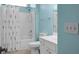 Bathroom features a shower with patterned curtain and a white single vanity at 1026 Briar Rose Ln, Ladson, SC 29456