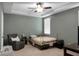 Comfortable bedroom featuring a tray ceiling, ceiling fan, and ample natural light at 1026 Briar Rose Ln, Ladson, SC 29456