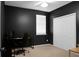 Black bedroom with window and white closet at 1026 Briar Rose Ln, Ladson, SC 29456