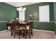 Cozy dining area with chandelier, bright windows, and comfortable seating at 1026 Briar Rose Ln, Ladson, SC 29456