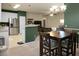 Dining area with modern lighting, seamlessly connected to the updated kitchen at 1026 Briar Rose Ln, Ladson, SC 29456