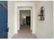 Open foyer showcasing tile floors, a decorative wall shelf, and a view into the living area at 1026 Briar Rose Ln, Ladson, SC 29456