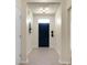Inviting foyer with neutral walls, a stylish light fixture, and tile flooring at 1026 Briar Rose Ln, Ladson, SC 29456