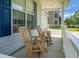 Relaxing front porch featuring rocking chairs and a view of the neighborhood at 1026 Briar Rose Ln, Ladson, SC 29456