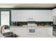 Spacious kitchen featuring white cabinets, modern appliances and ample counter space at 1026 Briar Rose Ln, Ladson, SC 29456