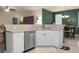 Open-concept kitchen showcasing stainless steel dishwasher and access to dining and living areas at 1026 Briar Rose Ln, Ladson, SC 29456