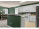 Updated kitchen featuring white cabinets, modern appliances, and a view into the dining area at 1026 Briar Rose Ln, Ladson, SC 29456