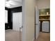 View from bedroom into the laundry room featuring washer, dryer, and shelves at 1026 Briar Rose Ln, Ladson, SC 29456