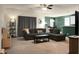 Comfortable living room with a gray sectional couch, a view of the dining area and neutral decor at 1026 Briar Rose Ln, Ladson, SC 29456
