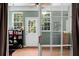Bright sunroom with hardwood floors, large windows, and stylish decor, providing a cozy retreat at 1026 Briar Rose Ln, Ladson, SC 29456